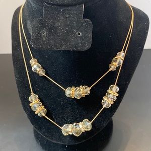 Double strand gold tone crystal bead and rhinestone necklace
